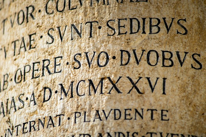 black latin text on curved surface